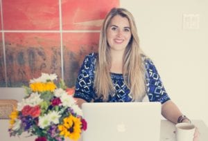 Natasha Smiling at Her Desk